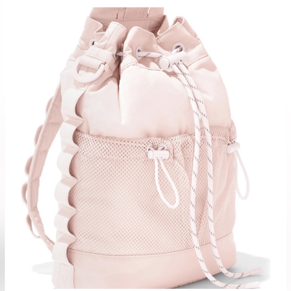 Dagne Dover Nova Repreve Recycled Polyester Sling Bag Backpack in Rose Quartz